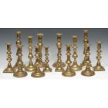A pair of Victorian brass baluster candlesticks, domed bases, 24.5cm high; another pair, stepped and