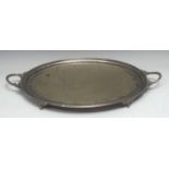 An interesting Victorian E.P.N.S oval two-handled serving tray, the field profusely engraved with an