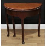 A George II mahogany demi-lune tea table, of small proportions, folding top above a deep frieze,