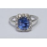 A Sapphire and diamond cluster ring, central octagonal cut mid blue Sri Lankan (Ceylon) sapphire,