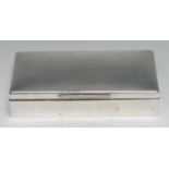 A large Edwardian silver rectangular cigarette box, quite plain, hinged cover enclosing three