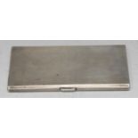 A George VI silver cigarette case, engine turned, gilt interior, 14cm long, Birmingham 1938, 8oz