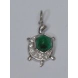 A novelty emerald and diamond pendant, as a turtle, irregular emerald cabochon crested with a row of