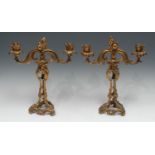 A pair of Rococo Revival two-light, two branch candelabra, cast throughout with flowers and
