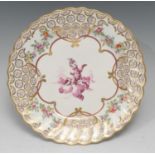 A Derby shaped circular dessert dish, painted by Richard Askew, in puce camieau with cherub on a