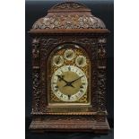 A Victorian oak musical bracket clock, 24cm arched brass dial with silvered chapter ring inscribed