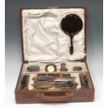 A comprehensive George V silver and tortoiseshell dressing table suite, comprising hair and