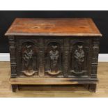 A Post-Medieval French rectangular chest, hinged top, the front with three softwood carvings