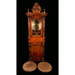 A 19th century walnut floor-standing coin operated penny-in-the-slot polyphon, vertical mechanism,
