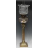 A Hink's Patent oil lamp, clear cut glass font supported by brass ionic column and stepped base,