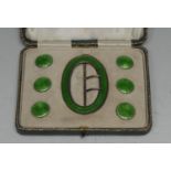 An Edwardian silver and emerald enamel dress suite, comprising six buttons and a buckle, the
