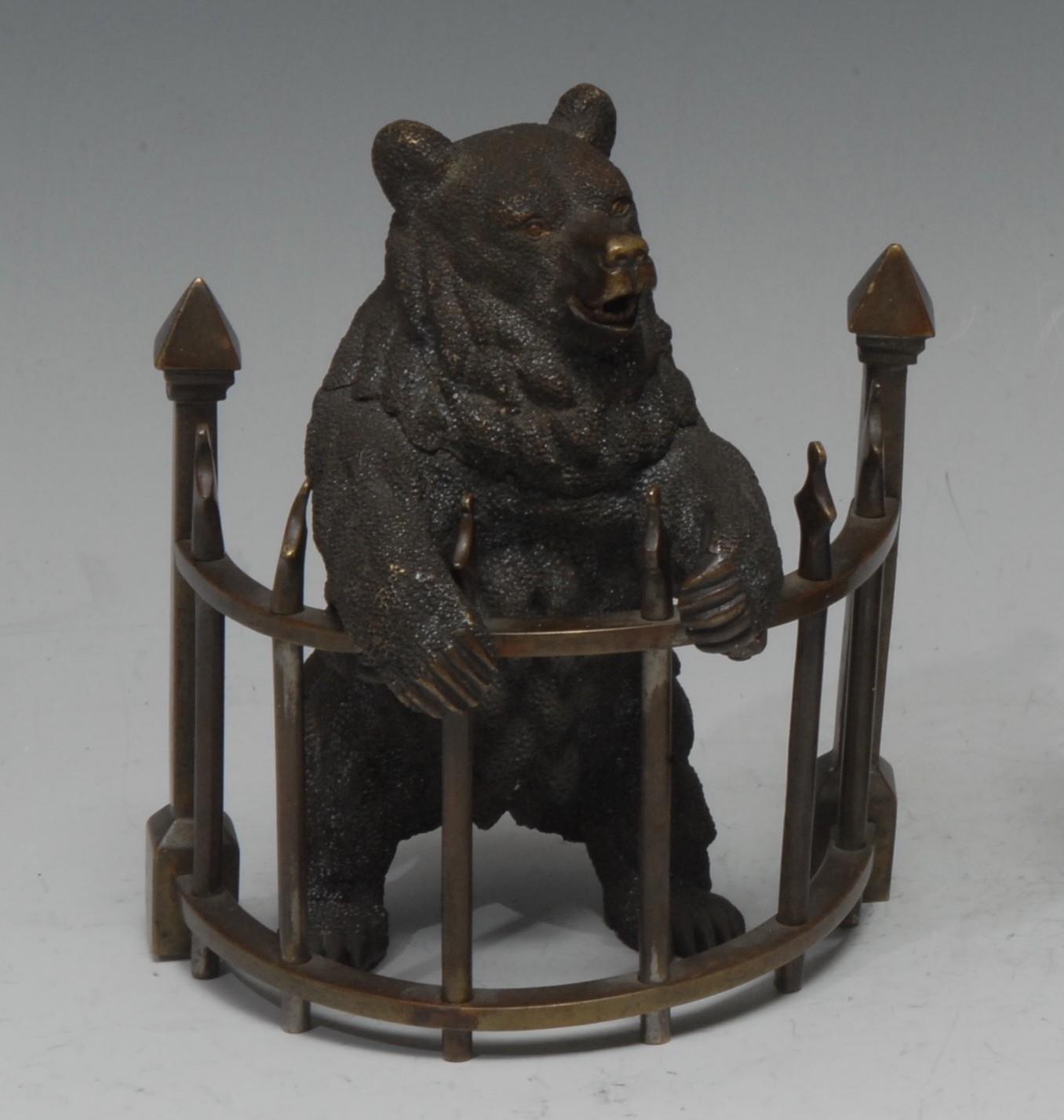 A 19th century brown patinated bronze novelty inkwell, as a Russian bear, on hind legs behing