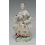 A Derby Patch Mark figure, of a lady seated with dog, 14cm high, c.1770