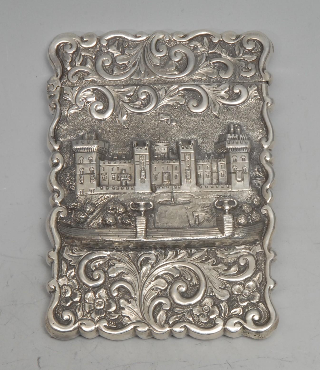 A Victorian silver shaped rectangular castle top visiting card case, embossed with a view of Windsor