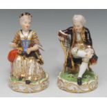 A pair of early 19th century Derby figures, Boy Reading a Book and Girl Tatting, in Regency