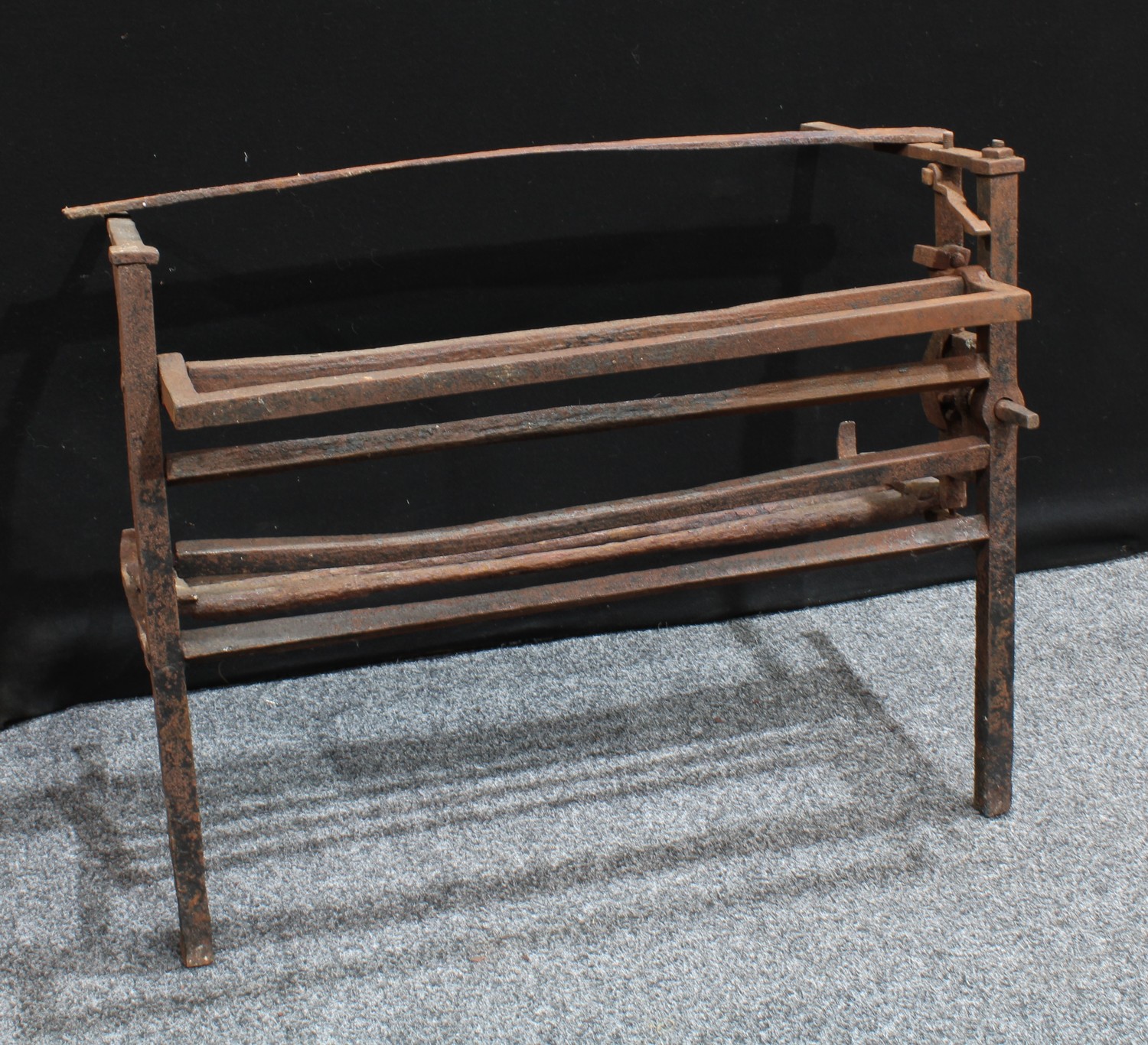 A country house cast iron fireplace hearth cooking rack, 71.5cm high, 90cm wide, 51cm deep