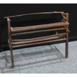 A country house cast iron fireplace hearth cooking rack, 71.5cm high, 90cm wide, 51cm deep