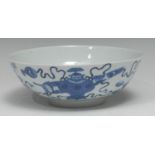 A Chinese circular bowl, painted in tones of underglaze blue with precious objects, 19.5cm diam,