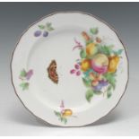 A Derby shaped circular plate, painted by George Complin, with fruit, butterfly and specimen sprigs,