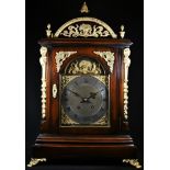 A George II style gilt metal mounted mahogany bracket clock, 18.5cm arched brass dial with