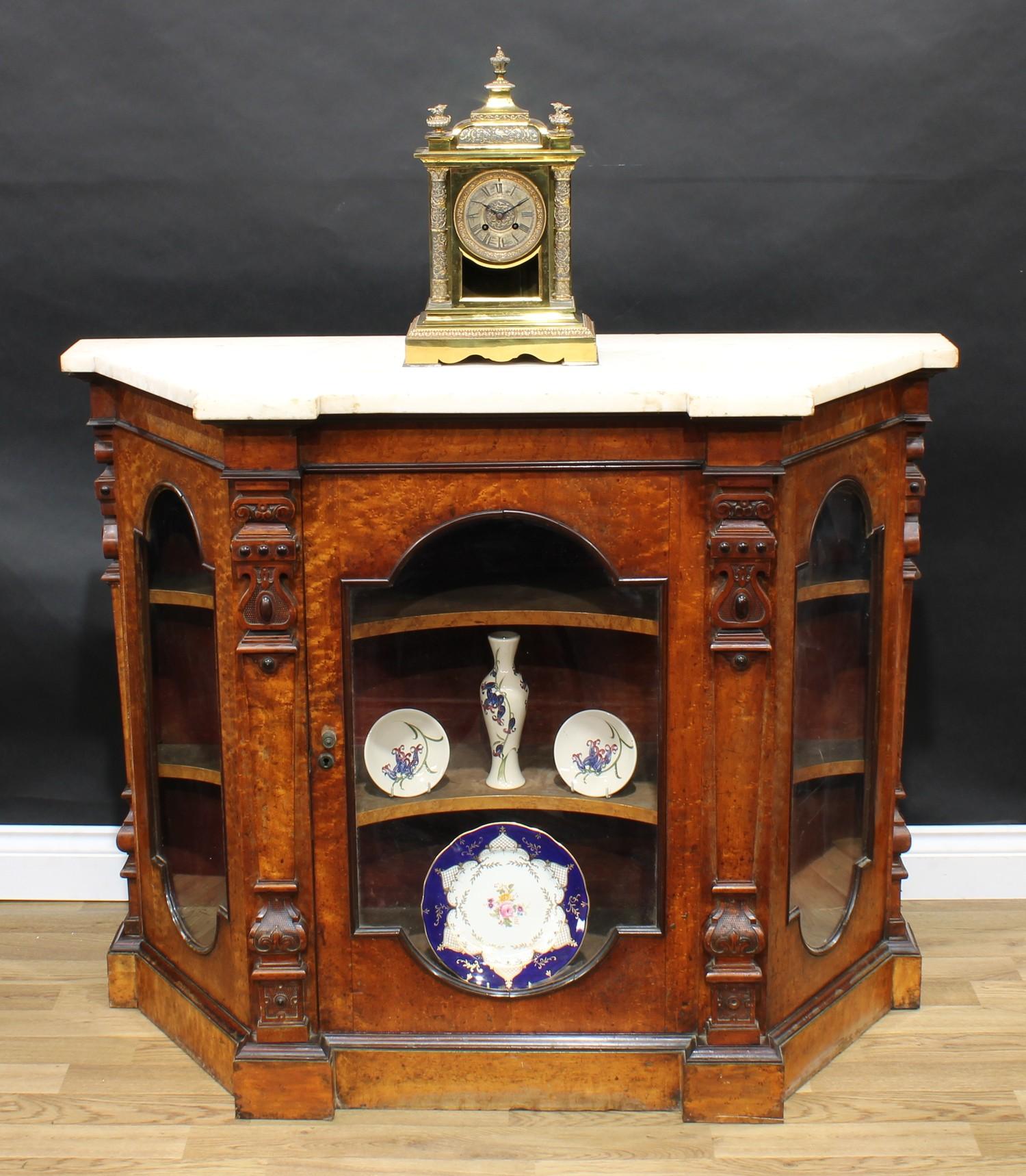 A 19th century maple canted rectangular side cabinet, white marble top above a glazed door enclosing