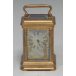 A French porcelain mounted lacquered brass miniature carriage timepice, 3cm rectangular clock dial