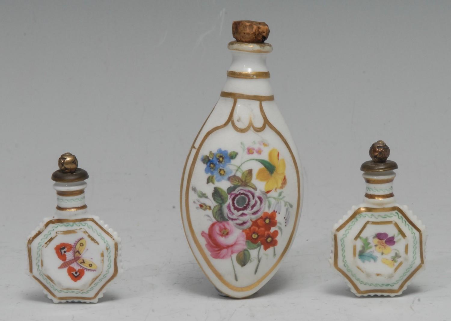 A pair of 19th century English porcelain novelty toy flattened octagonal scent bottles, each painted