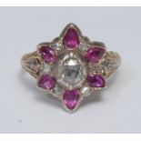 A 19th century ruby and diamond cluster ring, central oval rose cut diamond collar set, surrounded