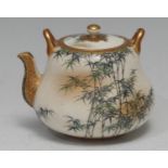 A Japanese satsuma ogee miniature chagama kettle, painted with leafy bamboo, the borders outlined in