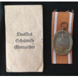 WW2 Third Reich Deutsches Schutzwall-Ehrenzeichen - West Wall Medal. Complete in packet of issue