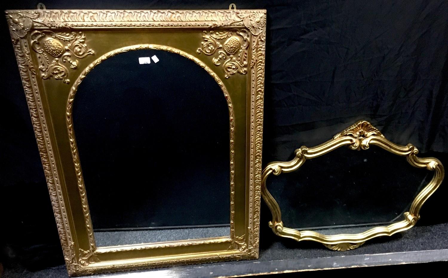 A modern gilt framed mirror; another, cartouche shaped (2)