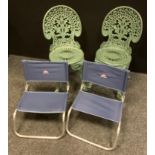 A pair of cast metal green painted garden chairs; a pair of Wynnster folding chairs (4)