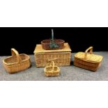 A wicker hamper; picnic basket; other assorted baskets. (5)