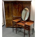 A Victorian flame mahogany compactum wardrobe, outswept cornice, two door cupboard over four