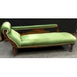 A Victorian oak chaise longue.