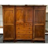 A Victorian mahogany compactum by Nolan and Sons, Dublin and London, stepped cornice, two door