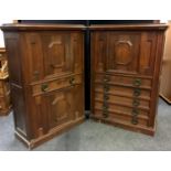 A near pair of 19th century style oak cupboards, fielded panel door to top over long drawer, brass