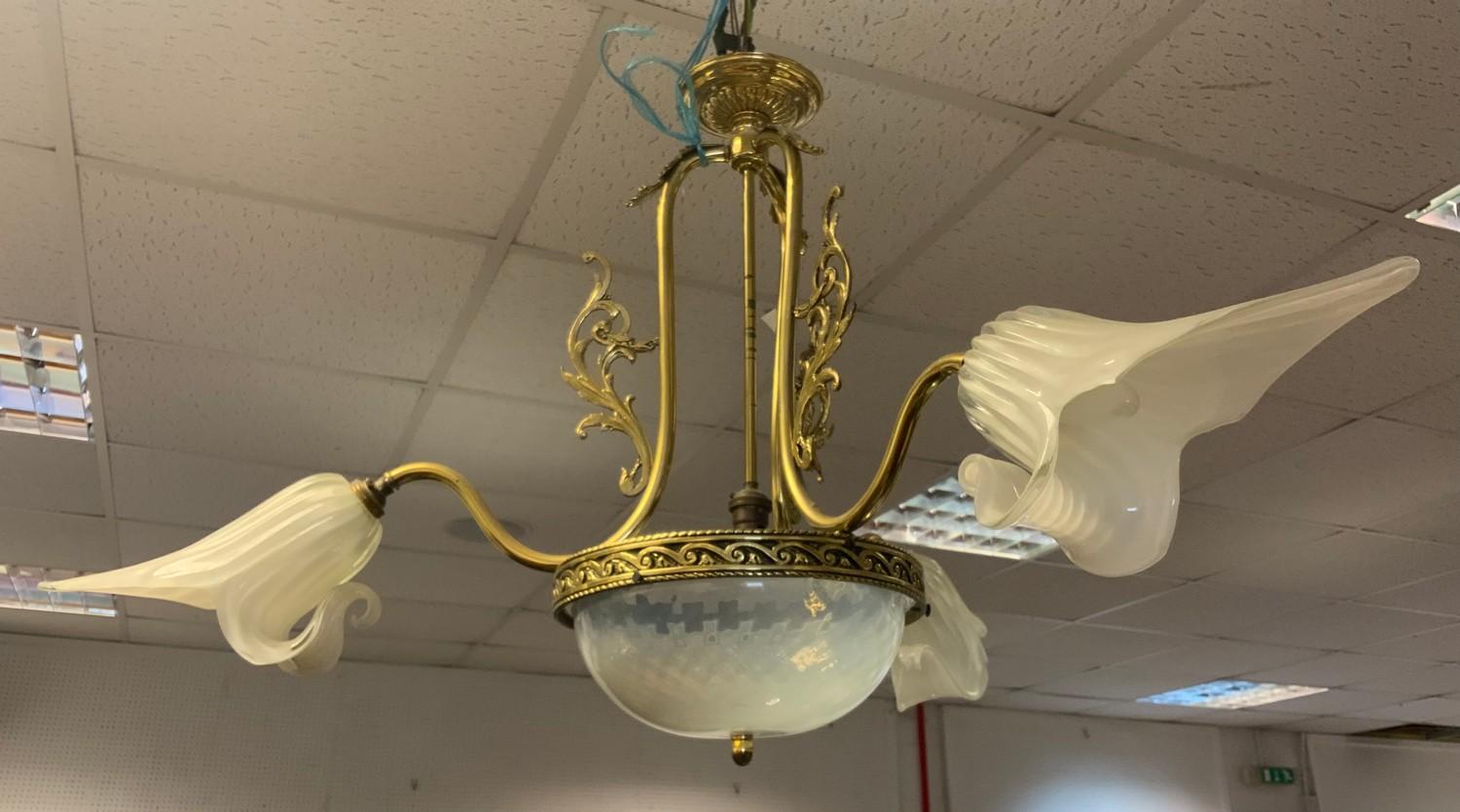 A gilt metal three branch ceiling lamp, opaque glass shades