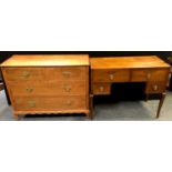 An oak kneehole dressing table; an oak chest of two short drawers over two long (formerly a dressing