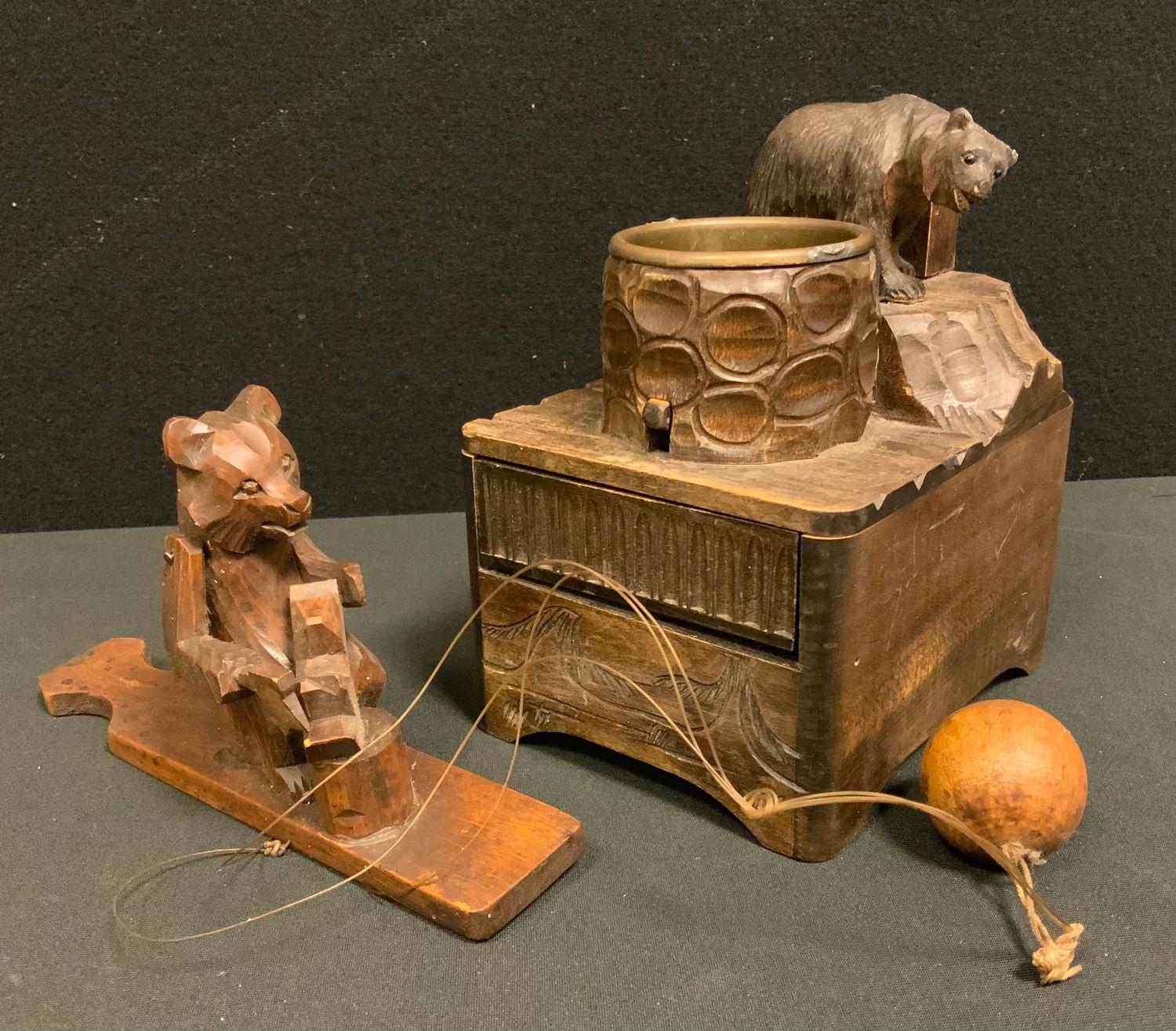 A novelty Black Forest Bear musical desk top cigarette box ashtray; a similar toy