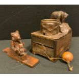A novelty Black Forest Bear musical desk top cigarette box ashtray; a similar toy