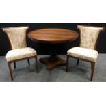 A mahogany pedestal table, circular top ringed column, quatrefoil base; two dining chairs with