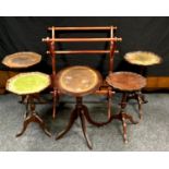 A reproduction mahogany tilt top occasional table, oval top; four reproduction wine tables,