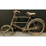 A 1930s/40s butchers/tradesman's bike, black and red frame, leaver brakes, Dunlop sprung seat,