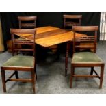 A Regency mahogany drop leaf table and four dining chairs. (5)