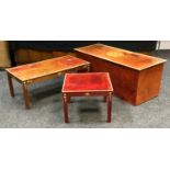 A stained pine occasional table with hand painted decoration by Hassif; a conforming coffee table; a