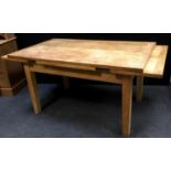 A contemporary light oak extending dining table. 81cm high x 91.5cm wide x 153cm long extending to