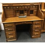 A modern roll top desk by Country Collection, fitted interior, long drawer over kneehole flanked