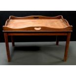 A mahogany butler’s tray type occasional table. 47cm high x 76cm long x 48cm wide.