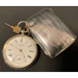 An Edwardian silver open face pocket watch, Waltham white enamel dial, bold Roman numerals, manual